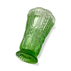 Vintage spring green pressed glass vase with scalloped rim and embossed geometric patterns, shown from various angles to highlight texture and translucence.