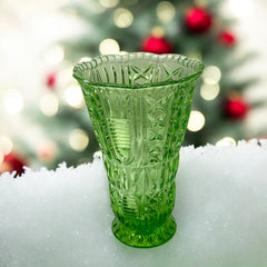 Vintage spring green pressed glass vase with scalloped rim and embossed geometric patterns, shown from various angles to highlight texture and translucence.