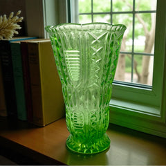 Vintage spring green pressed glass vase with scalloped rim and embossed geometric patterns, shown from various angles to highlight texture and translucence.