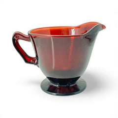 Vintage Anchor Hocking Royal Ruby Red glass creamer and cups set of 3, deep red translucent glass with glossy finish, shown in various angles to highlight design and condition.