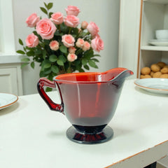 Vintage Anchor Hocking Royal Ruby Red glass creamer and cups set of 3, deep red translucent glass with glossy finish, shown in various angles to highlight design and condition.
