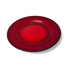 Vintage Anchor Hocking Royal Ruby relish trays arranged in a circular pattern around a coordinating red glass plate. The translucent ruby red glass glows with depth and symmetry, showcasing the sculptural triangular shapes and rich mid-century color. Ideal for holiday styling or vintage table settings.