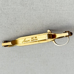Vintage Anson gold‑tone sword tie clip with silver‑tone grip and engraved details