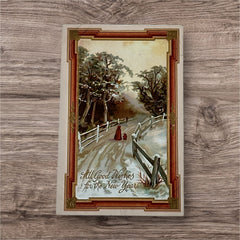 Antique 1910s embossed postcard featuring a snowy path with a person and child walking, framed by gilded orange-brown border; message reads “All Good Wishes for the New Year.
