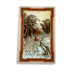 Antique 1910s embossed postcard featuring a snowy path with a person and child walking, framed by gilded orange-brown border; message reads “All Good Wishes for the New Year.