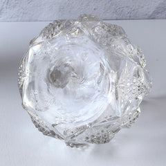 Antique pressed clear glass cruet with diamond pattern and rounded base.