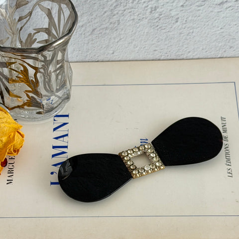 Antique Czech black glass and rhinestone sash buckle with silver‑tone two‑part closure.
