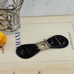 Antique Czech black glass and rhinestone sash buckle with silver‑tone two‑part closure.