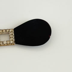 Antique Czech black glass and rhinestone sash buckle with silver‑tone two‑part closure.