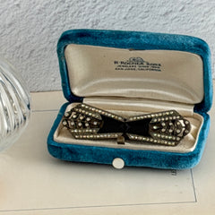 Antique Czech black glass and rhinestone belt buckle with two‑part silver‑tone construction.