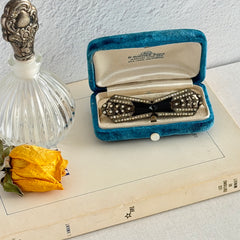 Antique Czech black glass and rhinestone belt buckle with two‑part silver‑tone construction.