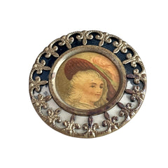 Antique Victorian portrait brooch with lithograph miniature, brass fleur‑de‑lys frame, and celluloid cover.