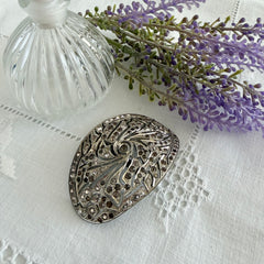 Large vintage 1920s Art Deco paste rhinestone floral shoe buckle with ornate pierced metalwork.
