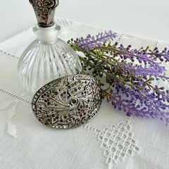 Large vintage 1920s Art Deco paste rhinestone floral shoe buckle with ornate pierced metalwork.