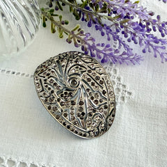 Large vintage 1920s Art Deco paste rhinestone floral shoe buckle with ornate pierced metalwork.