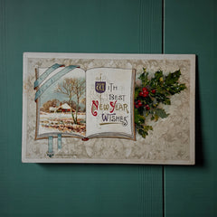 Antique embossed German New Year postcard from the 1910s featuring an open book with snowy countryside illustration, festive holly sprig, and ornate greeting text.