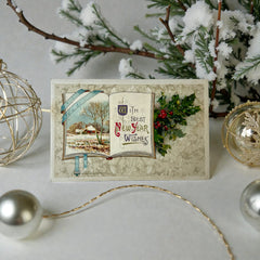 Antique embossed German New Year postcard from the 1910s featuring an open book with snowy countryside illustration, festive holly sprig, and ornate greeting text.