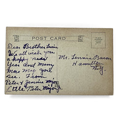 Antique 1910s New Year postcard showing a silver moonlit church and town skyline reflected on a river, with ornate red lettering “To Wish You A Happy New Year” and handwritten family message on reverse, very good condition with light corner wear.