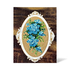 Antique 1910s New Year postcard featuring embossed blue forget-me-not flowers in a gold-gilded oval frame, set against a textured brown background resembling crocodile skin; elegant and well-preserved with handwritten 1913 message on reverse.