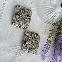 Pair of vintage 1920s paste rhinestone floral pot metal shoe buckles with original stones.