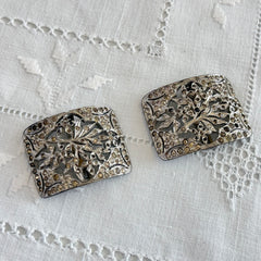 Pair of vintage 1920s paste rhinestone floral pot metal shoe buckles with original stones.