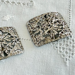 Pair of vintage 1920s paste rhinestone floral pot metal shoe buckles with original stones.