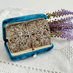 Pair of vintage 1920s paste rhinestone floral pot metal shoe buckles with original stones.