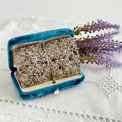 Pair of vintage 1920s paste rhinestone floral pot metal shoe buckles with original stones.