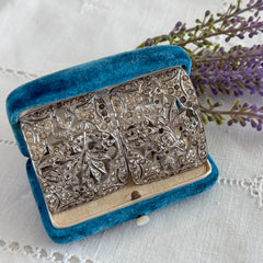 Pair of vintage 1920s paste rhinestone floral pot metal shoe buckles with original stones.