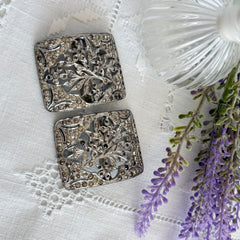Pair of vintage 1920s paste rhinestone floral pot metal shoe buckles with original stones.