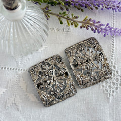 Pair of vintage 1920s paste rhinestone floral pot metal shoe buckles with original stones.