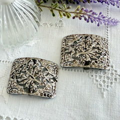 Pair of vintage 1920s paste rhinestone floral pot metal shoe buckles with original stones.