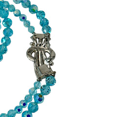 Vintage double‑strand aqua blue AB crystal necklace with faceted beads and a silver‑tone pavé rhinestone brooch clasp, shown from multiple angles to highlight bead size, sparkle, and clasp detailing.