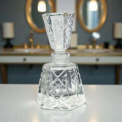 Vintage Czech hand-cut glass perfume bottle with faceted hexagon base and original stopper, shown in varied lighting to highlight its Art Deco silhouette and reflective clarity.