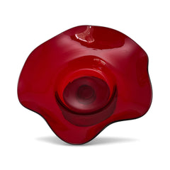 Vintage ruby red hand-blown glass bowl with a freeform wavy rim and clear pedestal base, photographed from above to highlight its organic curves and glossy surface. Midcentury compote style, ideal for decorative or serving use.