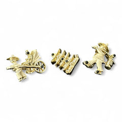 Set of three vintage Asian-themed scatter brooches in white enamel and gold tone, featuring a rickshaw scene, a pagoda, and a man carrying food boxes on a shoulder cane, displayed on a black background.