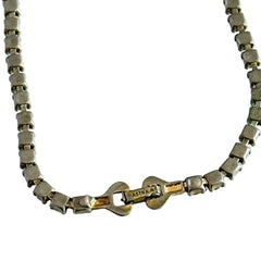 A vintage Astra necklace featuring glowing faux opal cabochons and deep amethyst stones in a double‑row midcentury design, shown on a neutral background to highlight its color and detail.