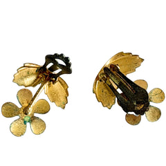 Vintage Austrian blue and green granulated enamel floral clip‑on earrings with rhinestone accents, shown from multiple angles to display their mid‑century design.