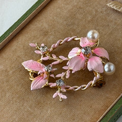 Vintage Austrian pink enamel floral heart brooch with faux pearls and rhinestones on gold‑plated heart frame.