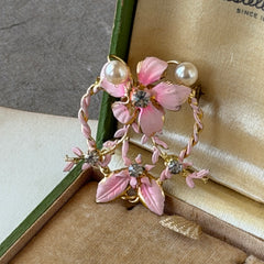 Vintage Austrian pink enamel floral heart brooch with faux pearls and rhinestones on gold‑plated heart frame.