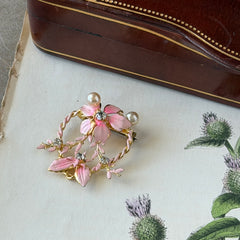 Vintage Austrian pink enamel floral heart brooch with faux pearls and rhinestones on gold‑plated heart frame.