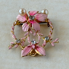 Vintage Austrian pink enamel floral heart brooch with faux pearls and rhinestones on gold‑plated heart frame.