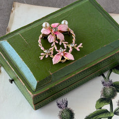 Vintage Austrian pink enamel floral heart brooch with faux pearls and rhinestones on gold‑plated heart frame.