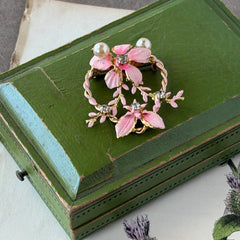 Vintage Austrian pink enamel floral heart brooch with faux pearls and rhinestones on gold‑plated heart frame.