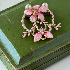 Vintage Austrian pink enamel floral heart brooch with faux pearls and rhinestones on gold‑plated heart frame.