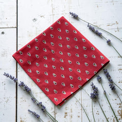 Provence cotton napkins in red and yellow floral Avignon pattern by Marat d’Avignon, displayed in soft natural light.
