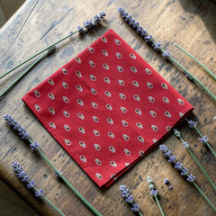 Provence cotton napkins in red and yellow floral Avignon pattern by Marat d’Avignon, displayed in soft natural light.