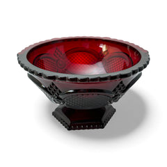 Vintage Avon ruby red glass compote with scalloped rim and pedestal base, featuring embossed Cape Cod pattern and rich crimson hue; a collectible 1970s–1990s candy dish styled for festive tables or vintage decor.