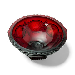 Vintage Avon ruby red glass compote with scalloped rim and pedestal base, featuring embossed Cape Cod pattern and rich crimson hue; a collectible 1970s–1990s candy dish styled for festive tables or vintage decor.