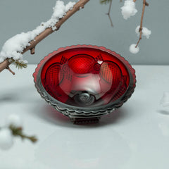 Vintage Avon ruby red glass compote with scalloped rim and pedestal base, featuring embossed Cape Cod pattern and rich crimson hue; a collectible 1970s–1990s candy dish styled for festive tables or vintage decor.